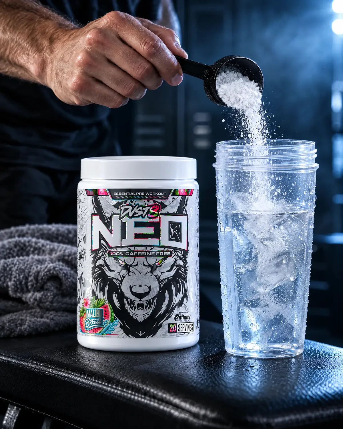 A scoop of NEO tipped into a shaker of ice water beside a Malibu Breeze tub